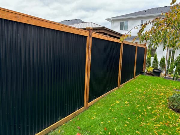 Wood and metal privacy fence